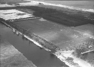 Photographed in Town of Gulf Stream, Florida, Date:1930s, Polo was a highly regarded sport in Gulf Stream as can be seen during this polo match, circa 1930s. Hundreds of spectators came to watch the matches. Some anchored their yachts in the Intracoastal, while others parked their cars in double rows along the palm-lined fields. In the distance, one can see the ocean and the original configuration of SR A1A adjacent the beach. It has since been relocated to the west.